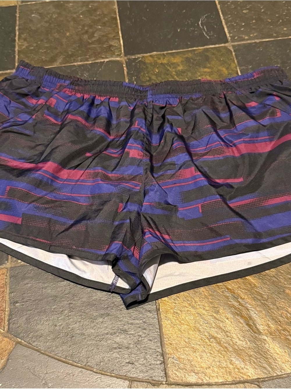 Nike Women’s Black Athletic Shorts with Blue and Purple Stripe Accents